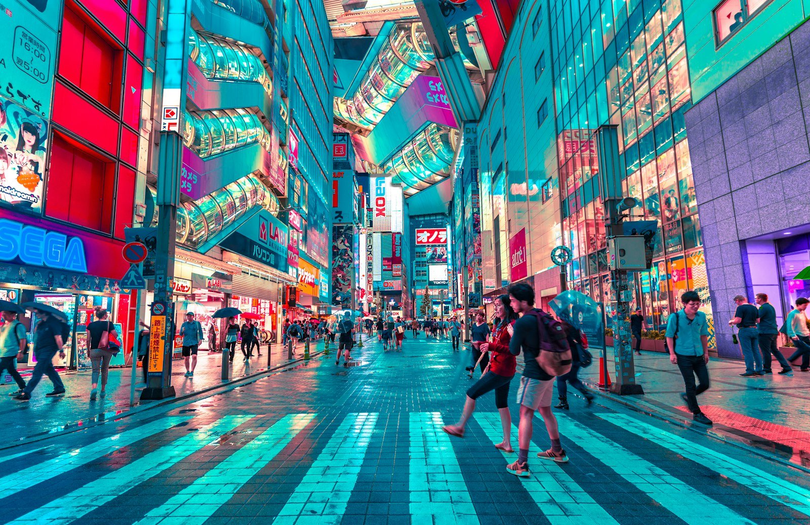 A neon-lit crossing in Tokyo at night